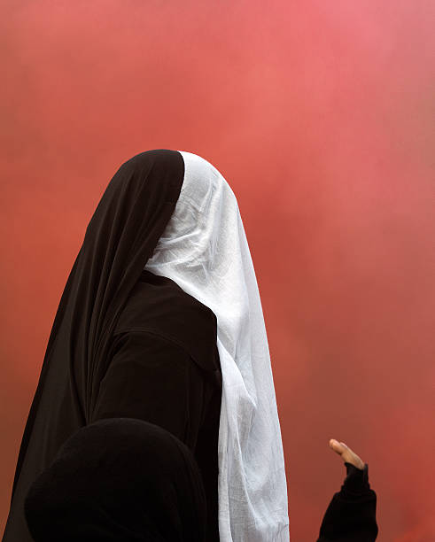 istock muslim woman isolated on red 174991757