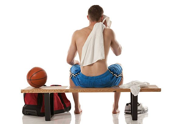 istock Sportsman resting on a bench after practice 174992032