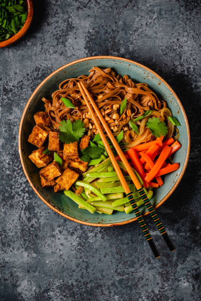 istock Soba noodles with vegetables and fried tofu in a bowl. 1749922368