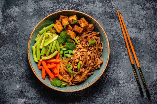 istock Soba noodles with vegetables and fried tofu in a bowl. 1749922369