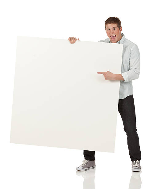 istock Excited man pointing at a placard 174992258
