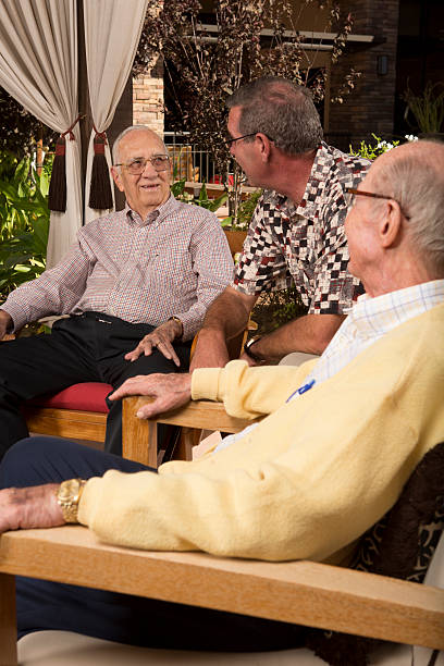 istock Man visiting Senior Adults in retirement home 174992728