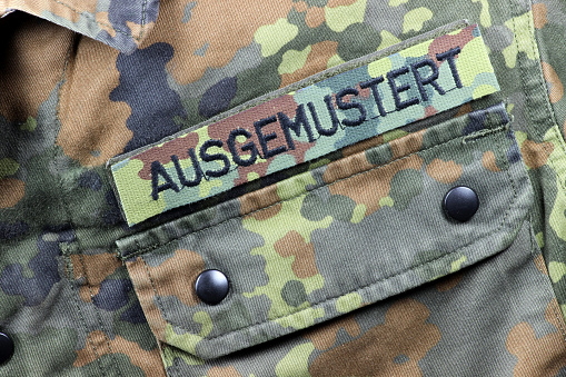 German camouflage uniform jacket patched AUSGEMUSTERT ('withdrawn from service') instead of name tag