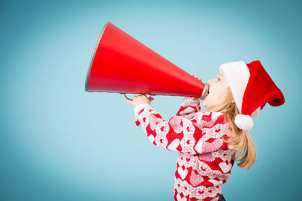 istock Santa's Little Helper Making Announcement With Megaphone 174993077