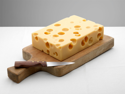 Emmental cheese on chopping boardMore like this :