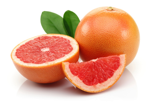 fresh grapefruit fruit with cut isolated on white background