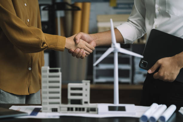 istock Businessmen shake hands after agreeing to start a new project successfully. 1749944639