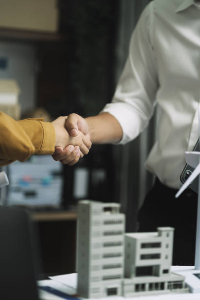 istock Businessmen shake hands after agreeing to start a new project successfully. 1749944662