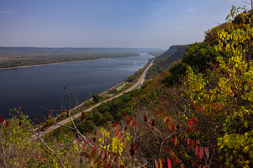 A scenic view of the Mississippi River with lock and dam during autumn.