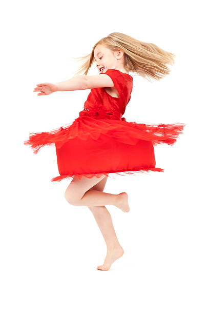 LIttle girl spinning round. Some motion blur