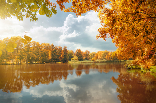 clouds over a village pond in autumn. Photo taken in Thuringia, Germany