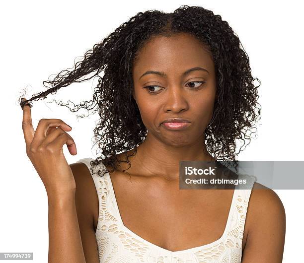 Foto de Entediado Jovem Mulher Brincando Com Seu Cabelo e mais fotos de stock de Rodar - Rodar, Mulheres, Só Uma Mulher