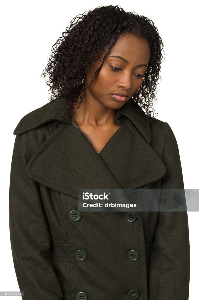 Sad Young Woman Looking Down Portrait of a young woman on a white background. 20-24 Years Stock Photo