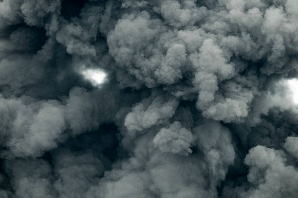 Dark Smoke Dark smoke generated by Volcano eruption. Looking straight up. jawa timur stock pictures, royalty-free photos & images