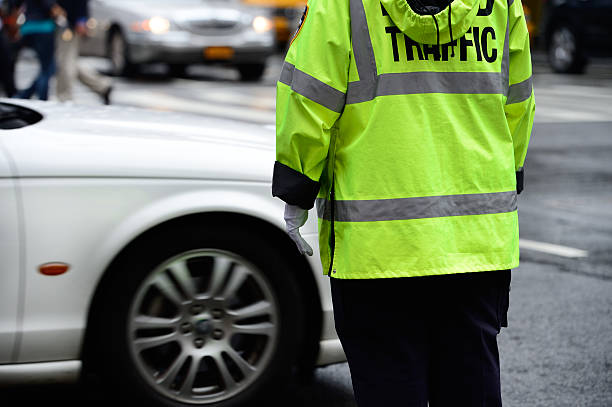 istock NYC traffic police in rain 174994847