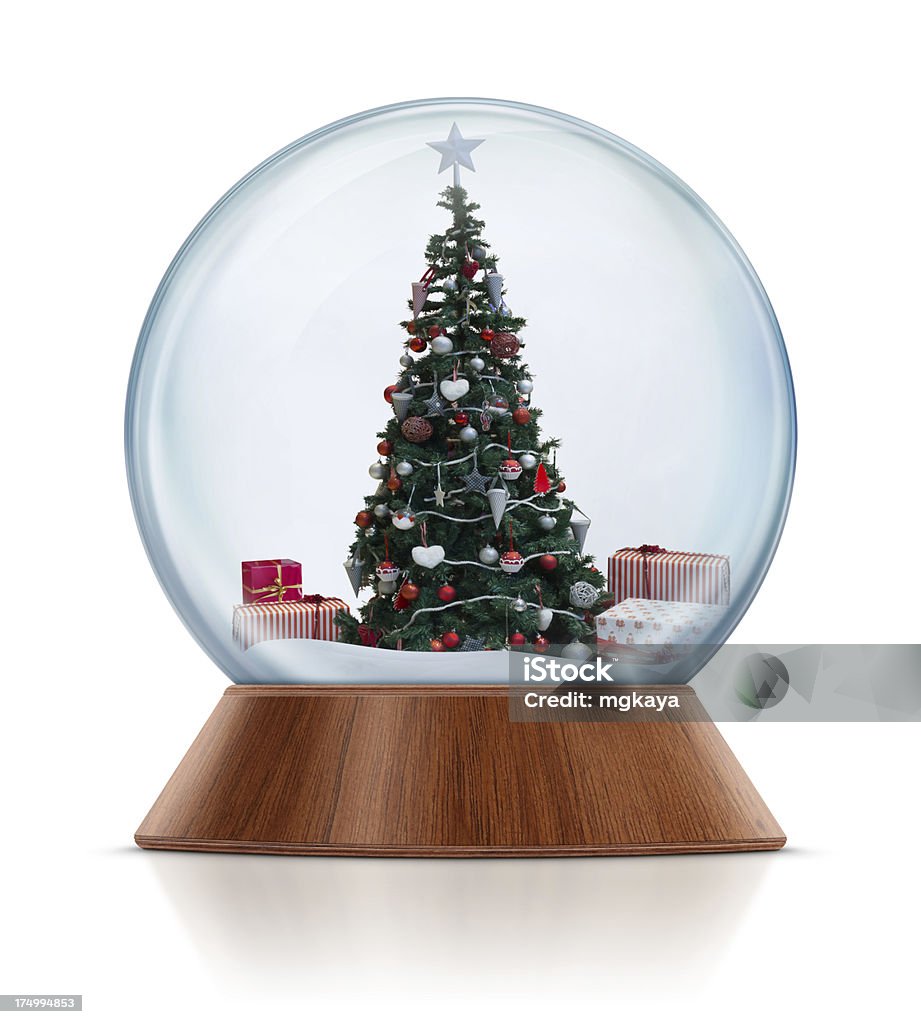 Christmas Tree in Snow Globe Christmas tree with gifts in the snow globe. Clean image and isolated on white background. Snow Globe Stock Photo