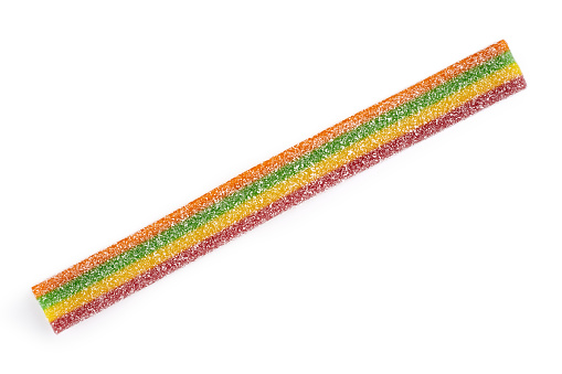 Multicolor gummy candy sweets on white background. Colored marmalade in the sugar on the yellow background. Natural rainbow colored marmalade candy. Liquorice candy