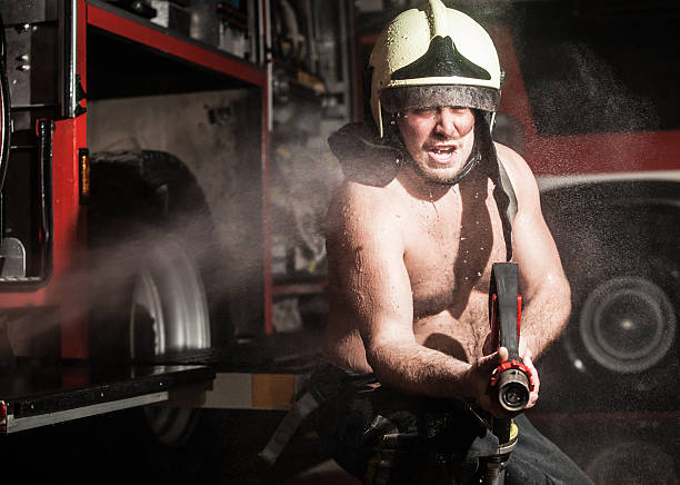 fireman en acción - action fire department car men fotografías e imágenes de stock