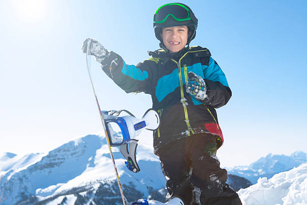 istock Boy snowboarder at the mountain 174995085
