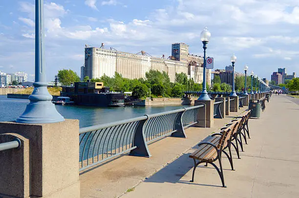 "Walkway along Promenade du Vieux-Port in Montreal, Quebec with Silo No. 5 in the distance."