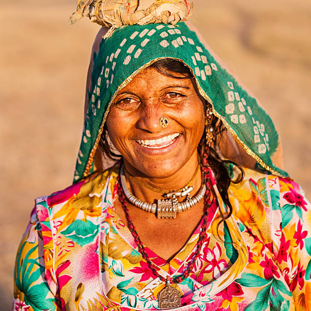 istock Indian woman carrying water, Rajasthan 174995327