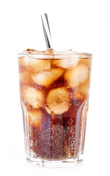 Cola in glass with straw and ice cubes isolated on white background. Soda with bubbles isolated on white. Refreshing non-alcoholic drink
