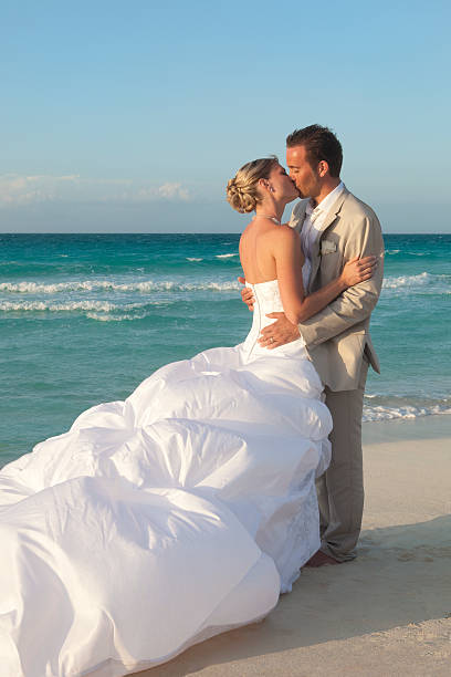 istock Bride And Groom Kissing On Tropical Beach 174996460