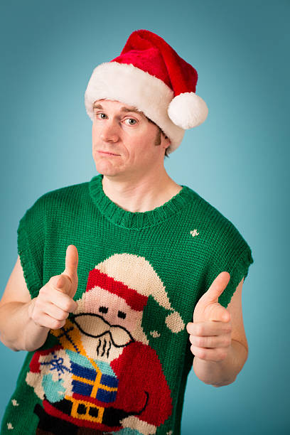 istock Man With Confident Look Wearing Santa Hat and Ugly Vest 174996484