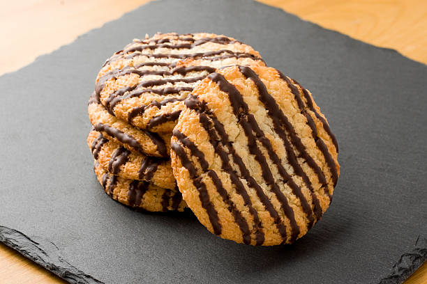 Chocolate Coconut Macaroons with a cup of tea in the background-Photographed on Hasselblad H3D2-39mb Camera
