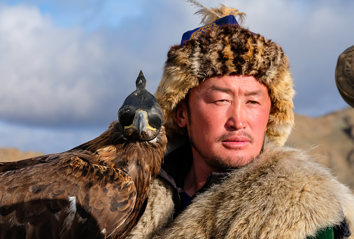 bayan Ulgii, Mongolia, 3rd October 2015: kazakh eagle hunter with his bird