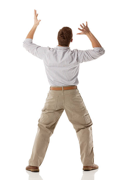 istock Rear view of a young man gesturing 174996897