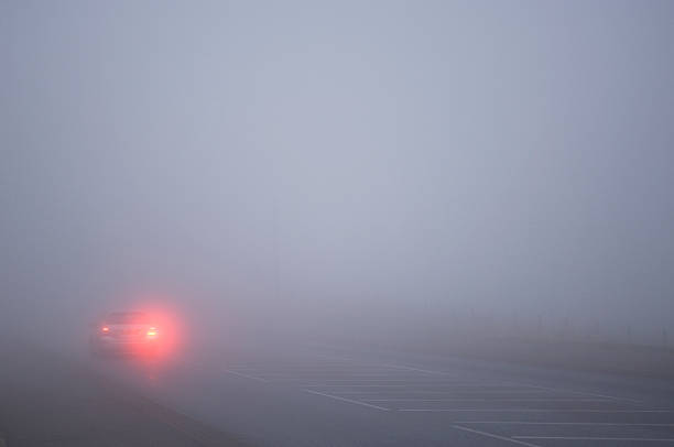 istock Car driving in thick fog 174996989