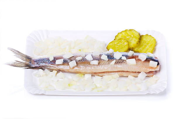 Traditional Jewish snack vorschmack or forshmak with bread and green onion, made of herring fillet .