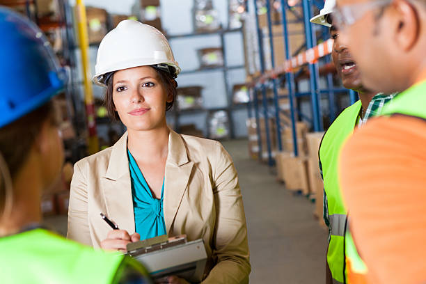 istock A female warehouse supervisor speaking to employees. 174997106