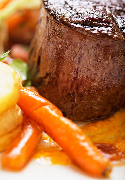 istock Juicy fillet steak with glazed carrots and potatoes 174997178