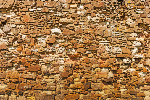 Stone wall on the flanks of the Lindisfarne Priory ruins.