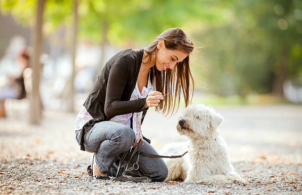 istock Young woman with her dog 174997309