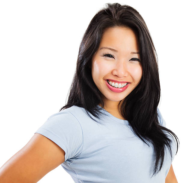 istock Attractive Young Asian Woman with Braces 174997380