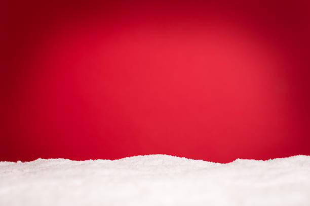 Snowy Christmas Background, With Copy Space "Red Christmas background with a cold, wintery feel. Includes room for text." fake snow stock pictures, royalty-free photos & images