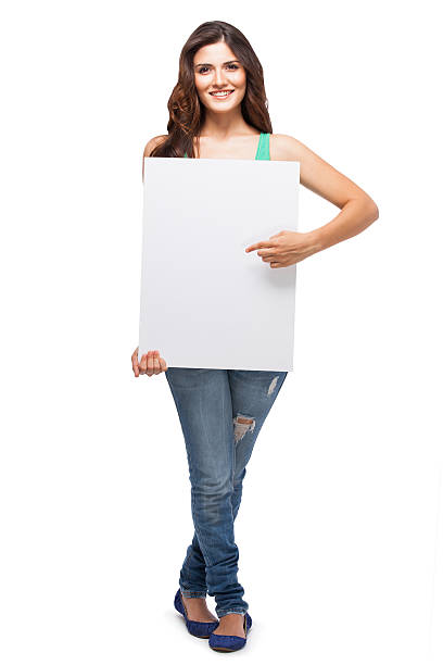 istock Young woman holding a blank sign 174997510