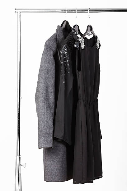 istock Women's dress, blouse and coat on rack 174997532