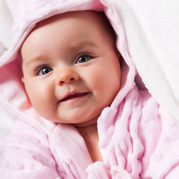 istock 6-7 months old happy baby in pink 174997778