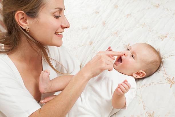 istock Mother play with baby 174997792