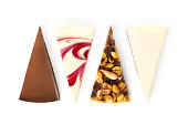 Assorted cheesecake pieces, chocolate, vanilla New York, strawberry, caramel. isolated on white background top view
