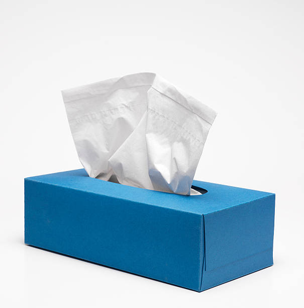 A plain blue tissue box on a white background stock photo