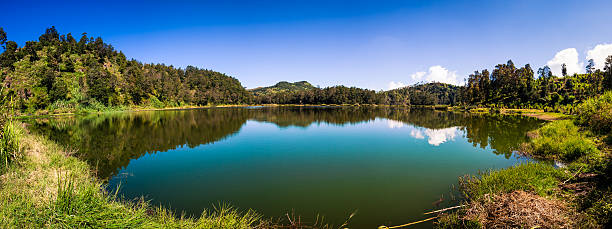 istock Beautiful Landscape with Green Lake Panorama 174998126