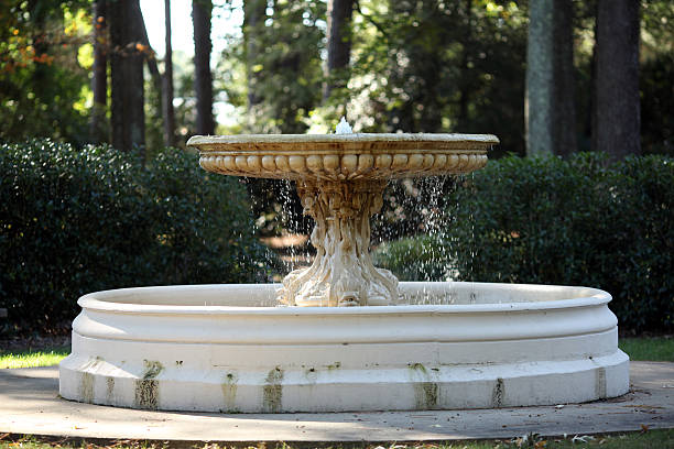 Decorative stone water fountain in outdoor garden