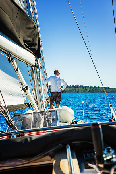 istock Crew member enjoying sailing on sailboat 174998672