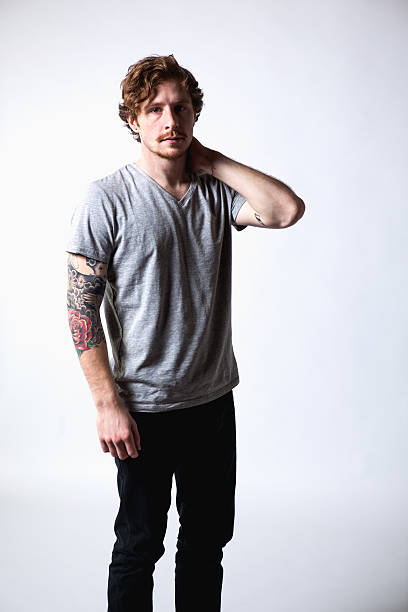 istock Young Attractive Caucasian Tattoo Hipster Man on White Background 174999125