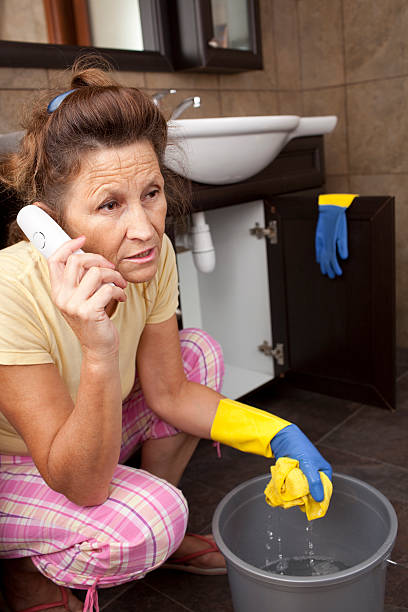istock Woman calling to plumbing service. 174999216